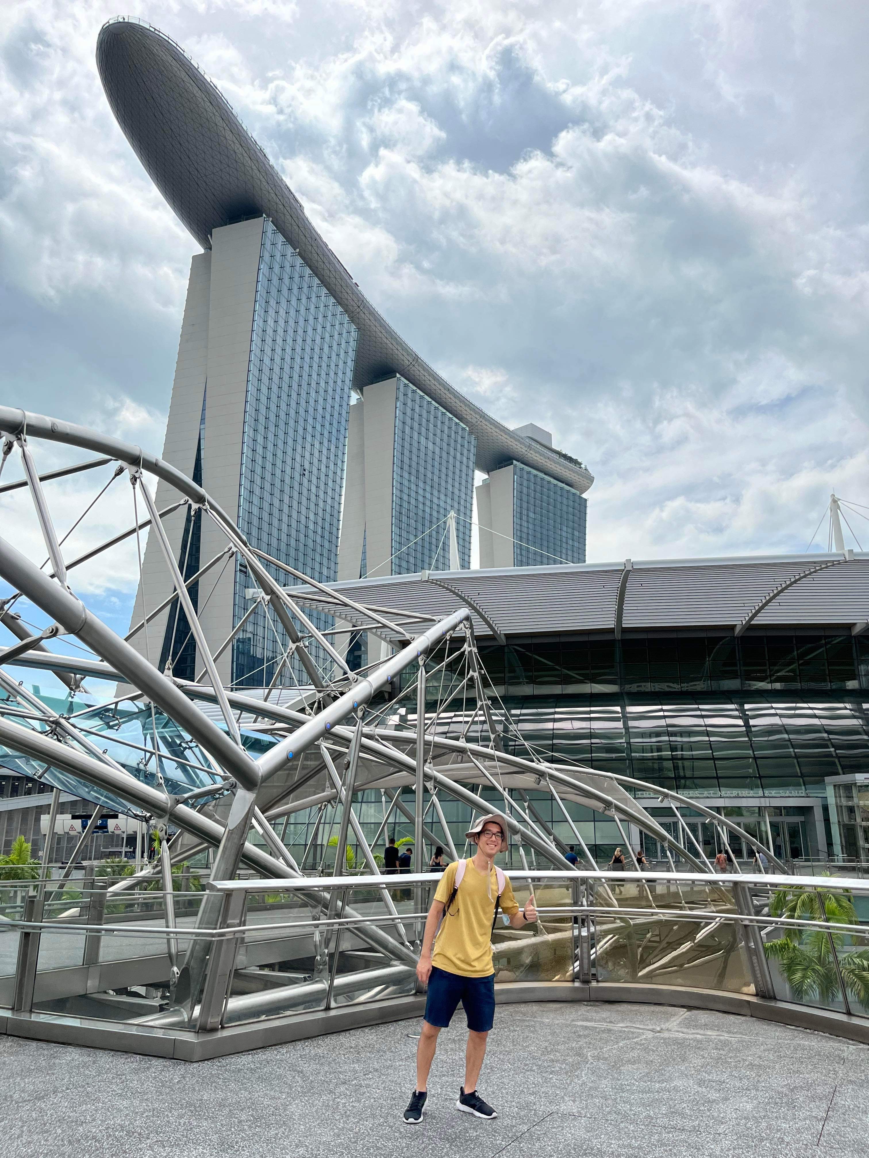 Me in front of Singapore's most impressive building (btw that hat is not mine)